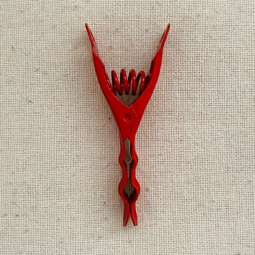 red stainless steel pegs
